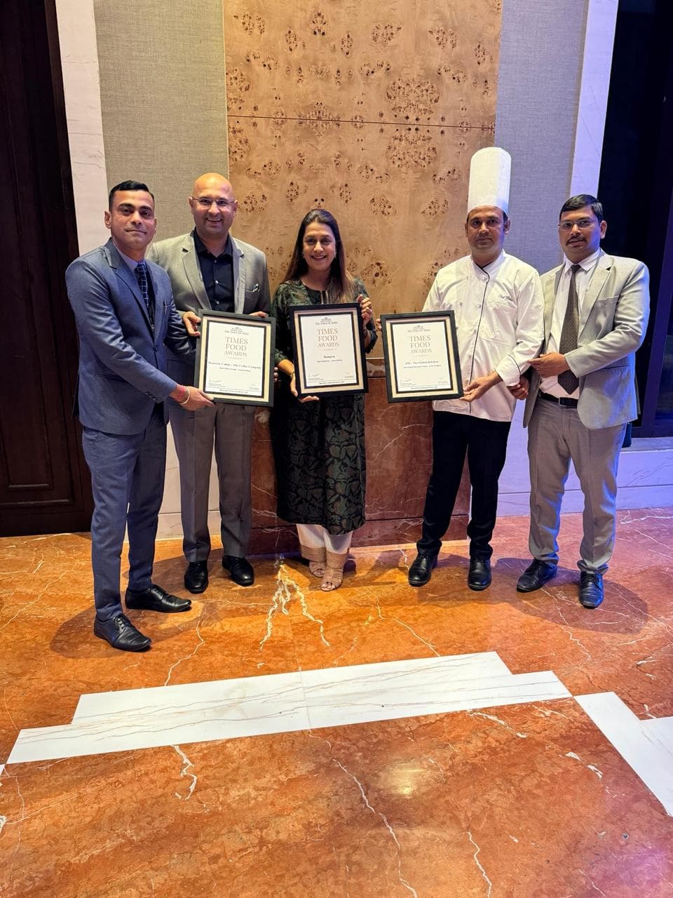 The founders and team with a chef holding their award certificates