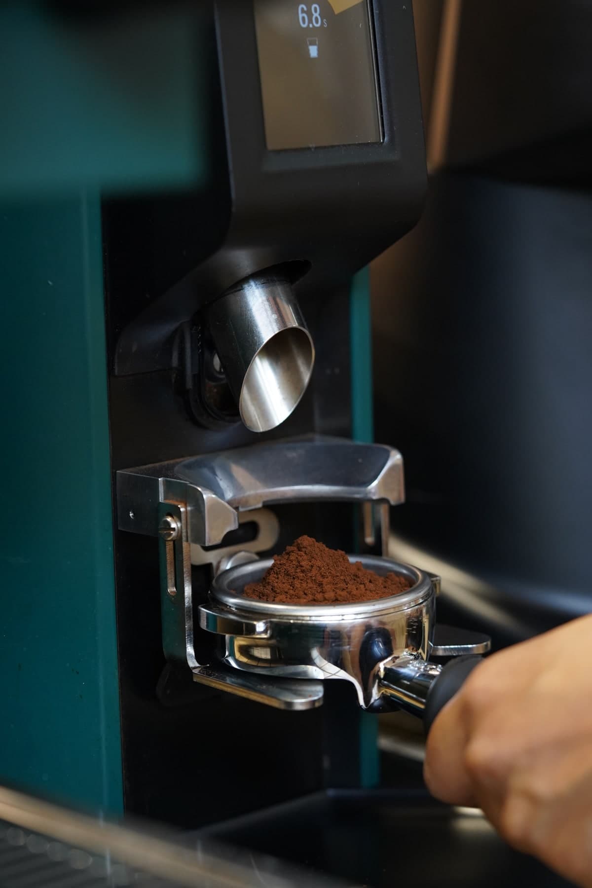 Ground coffee in a portafilter at Coffeeverse