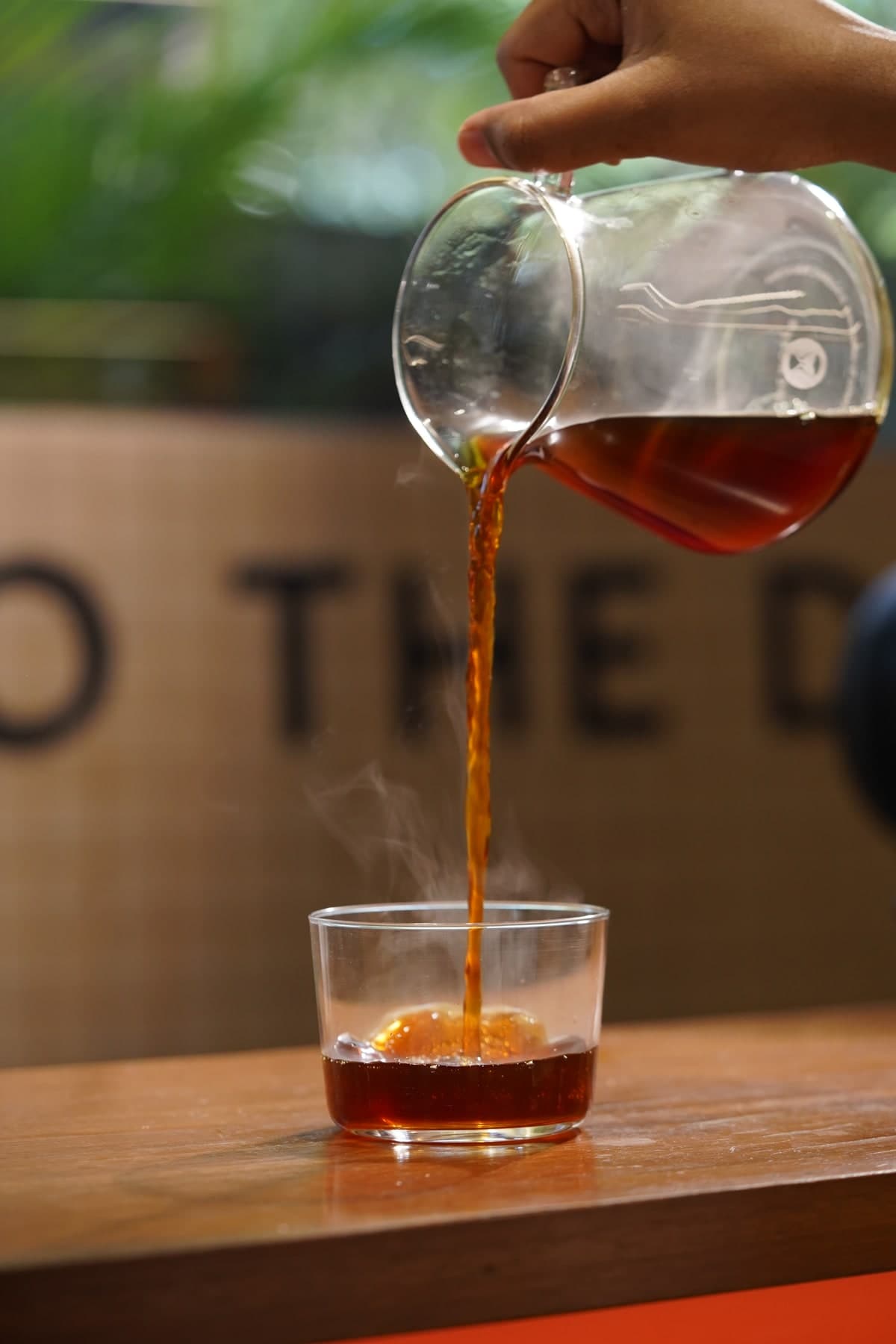 Coffee being poured into a glass at Coffeeverse