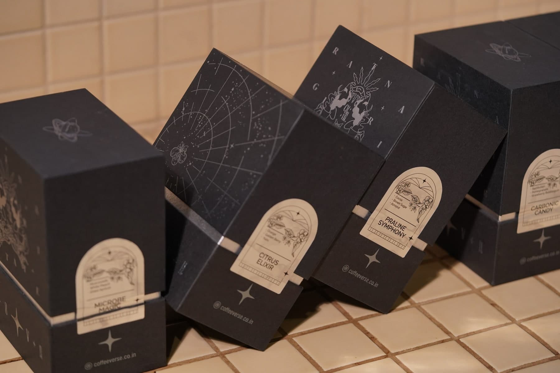Coffeeverse dark coffee boxes on a tiled counter