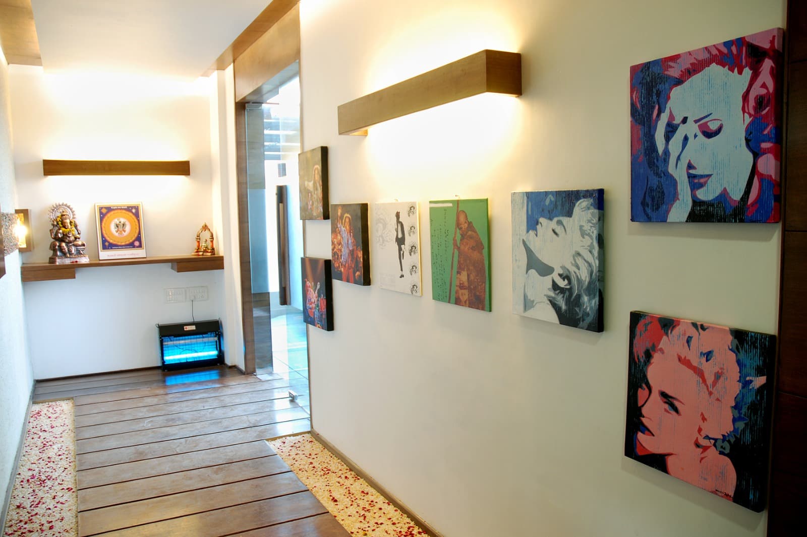 The Cooking Culture entrance corridor lined with pop-art canvases