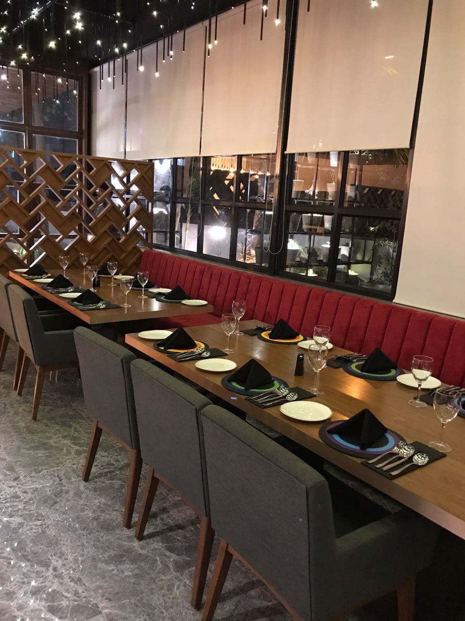 Long table set beside the banquette and window wall