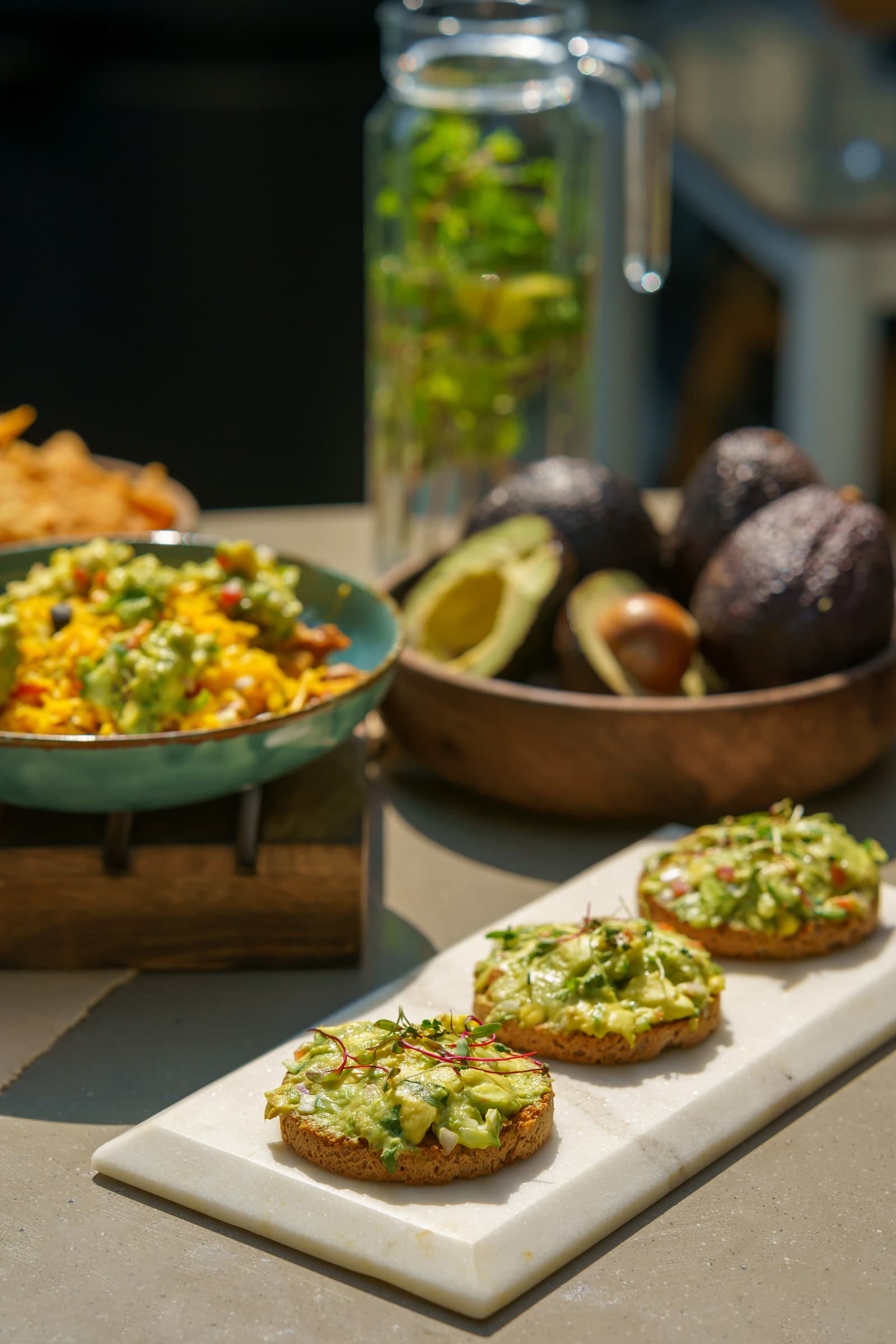 Avocado toast plated with a fresh salad