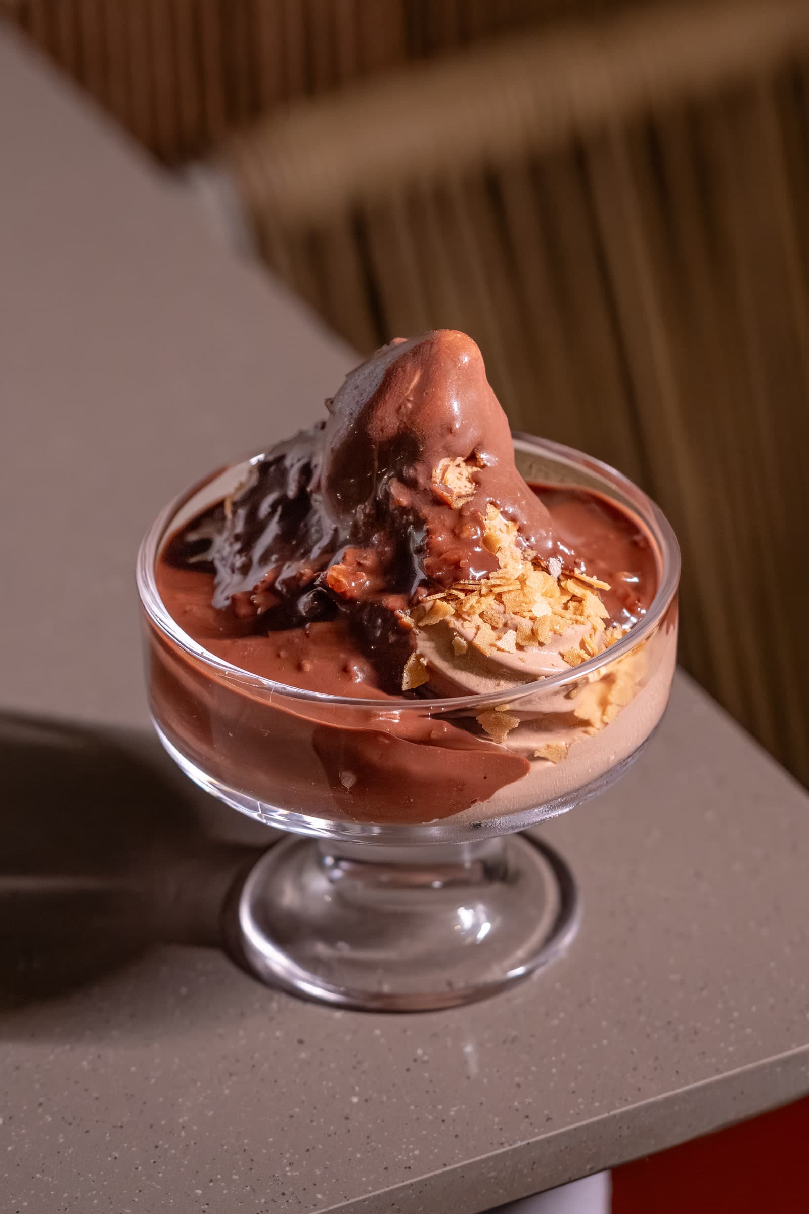 Chocolate dessert served in a coupe glass