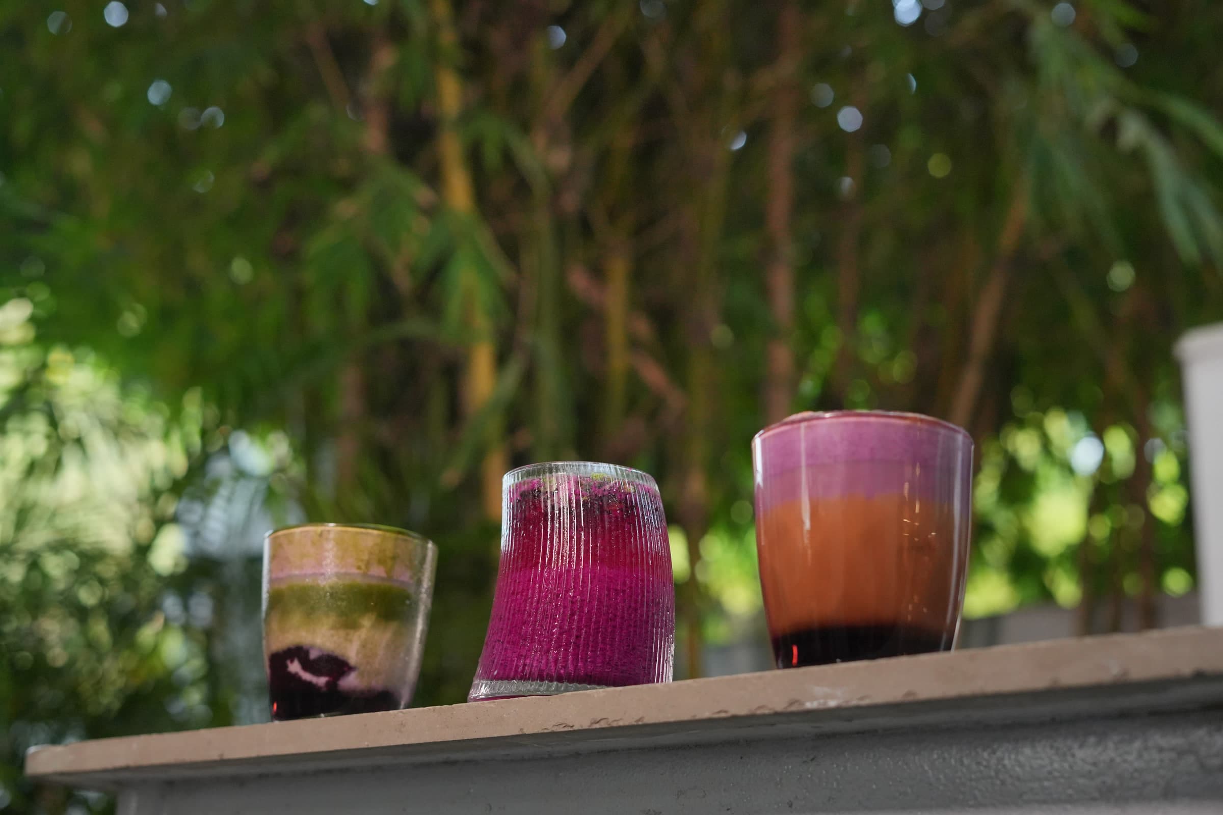 Iced drinks lined up along the garden-facing ledge