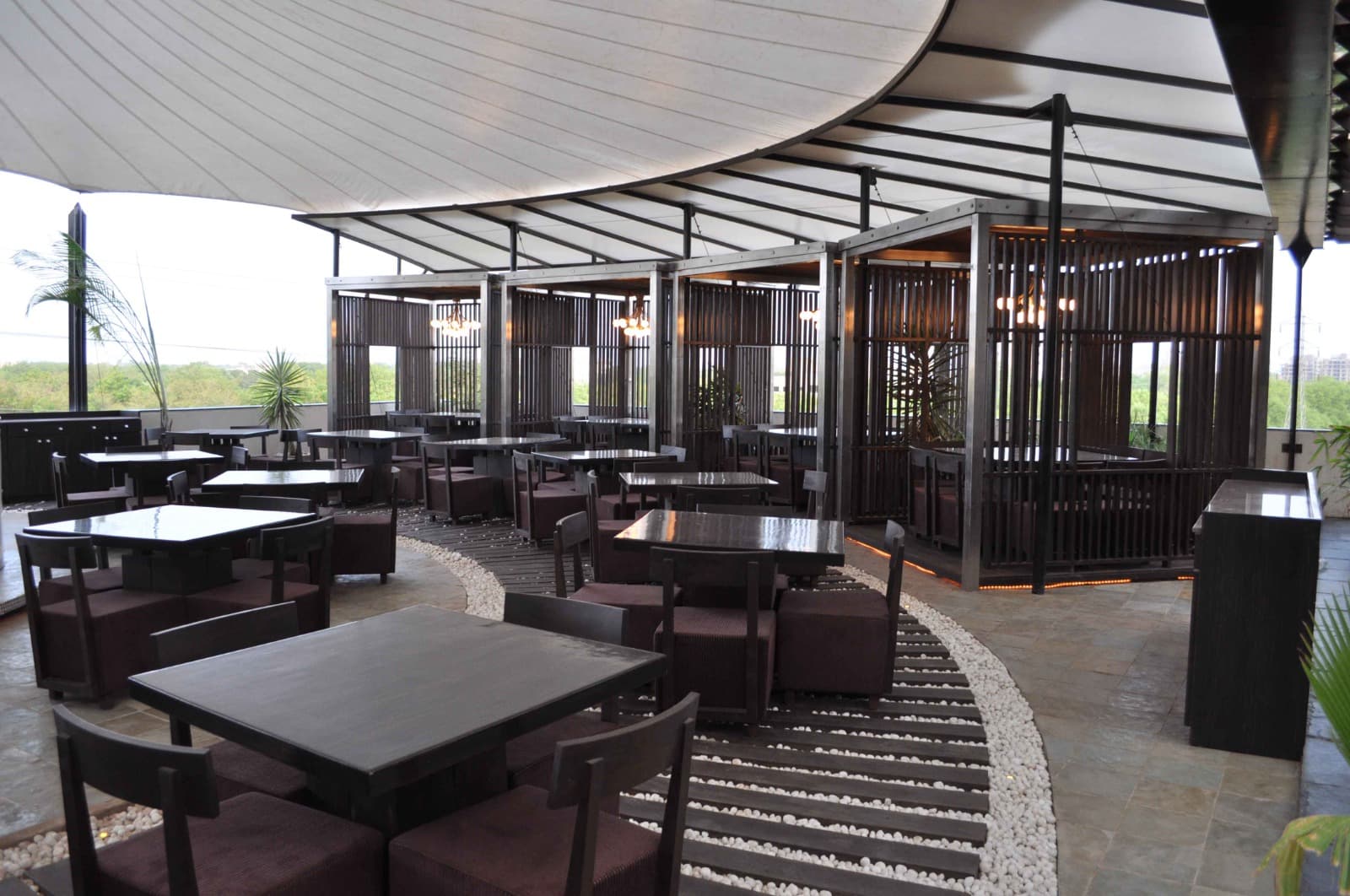 Spices and Herbs rooftop dining area under the tensile canopy