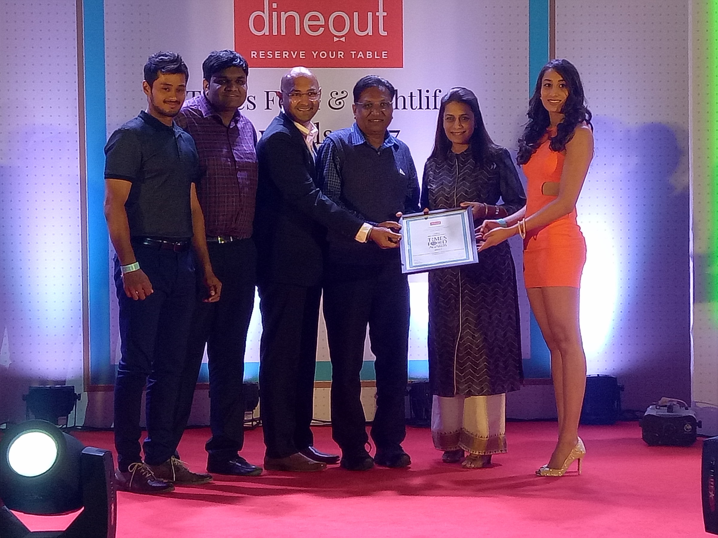 The team on stage collecting a Times Food Award at a Dineout ceremony