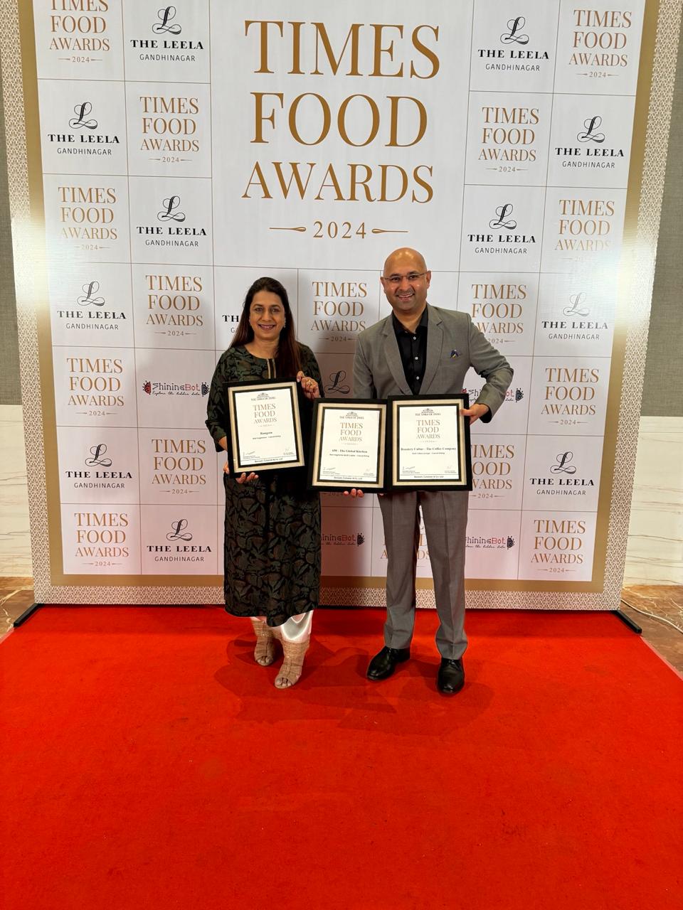 The founders with three award certificates at the Times Food Awards 2024 backdrop