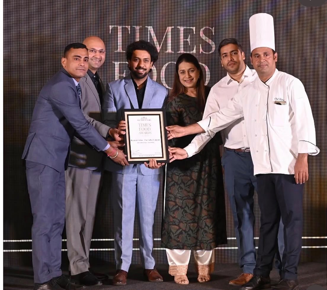 The Roastery Cultúr team receiving the Best Coffee Lounge award on stage