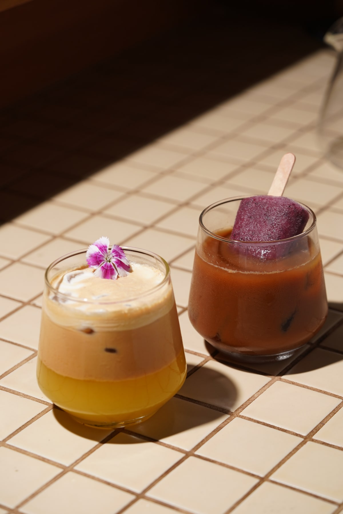 Coffeeverse drinks served on a tiled table