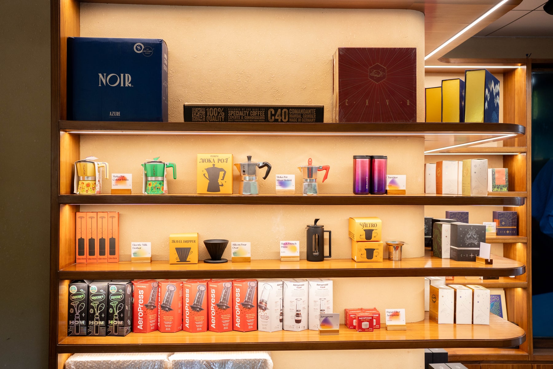 Coffeeverse shelves displaying coffee products and brewing equipment