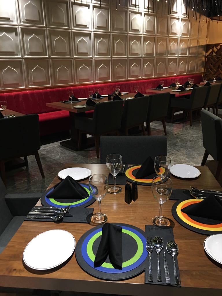 Table set for service in front of the carved panelled wall