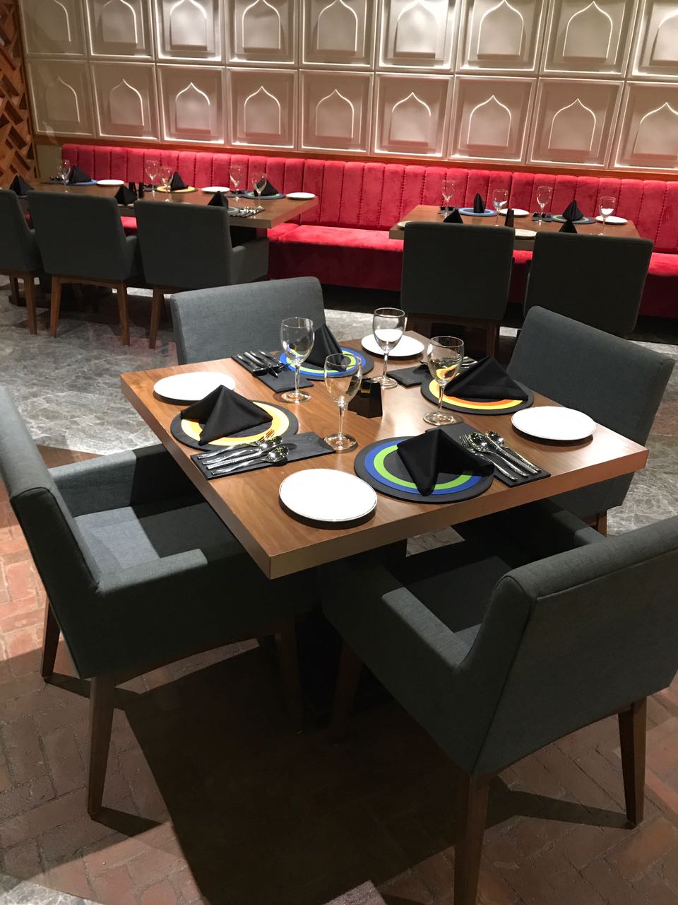 Table laid for service beside the red banquette, seen from above