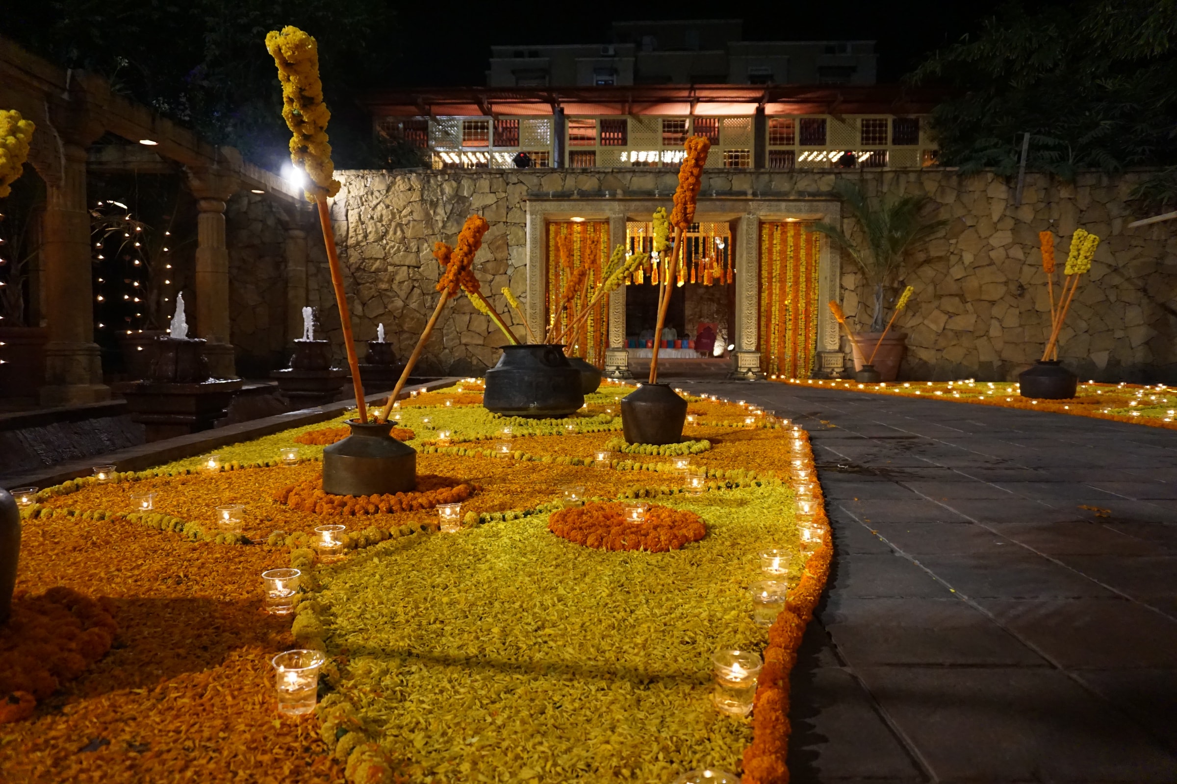 Yellow marigold carpet lit with lamps in the heritage courtyard