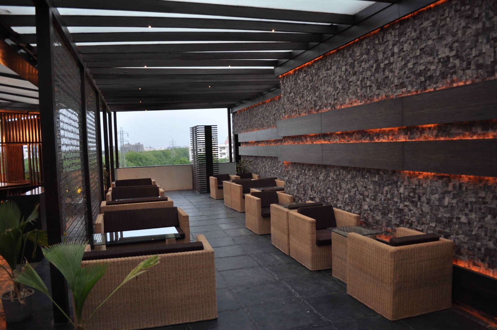Spices and Herbs rooftop seating and bar at dusk