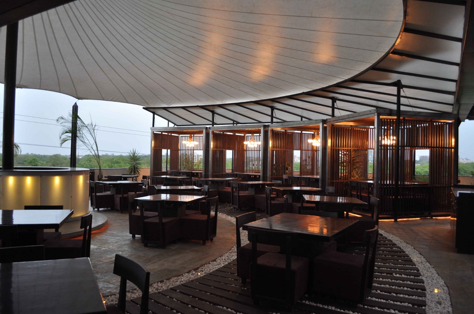 Spices and Herbs rooftop lounge seating beside the stone feature wall